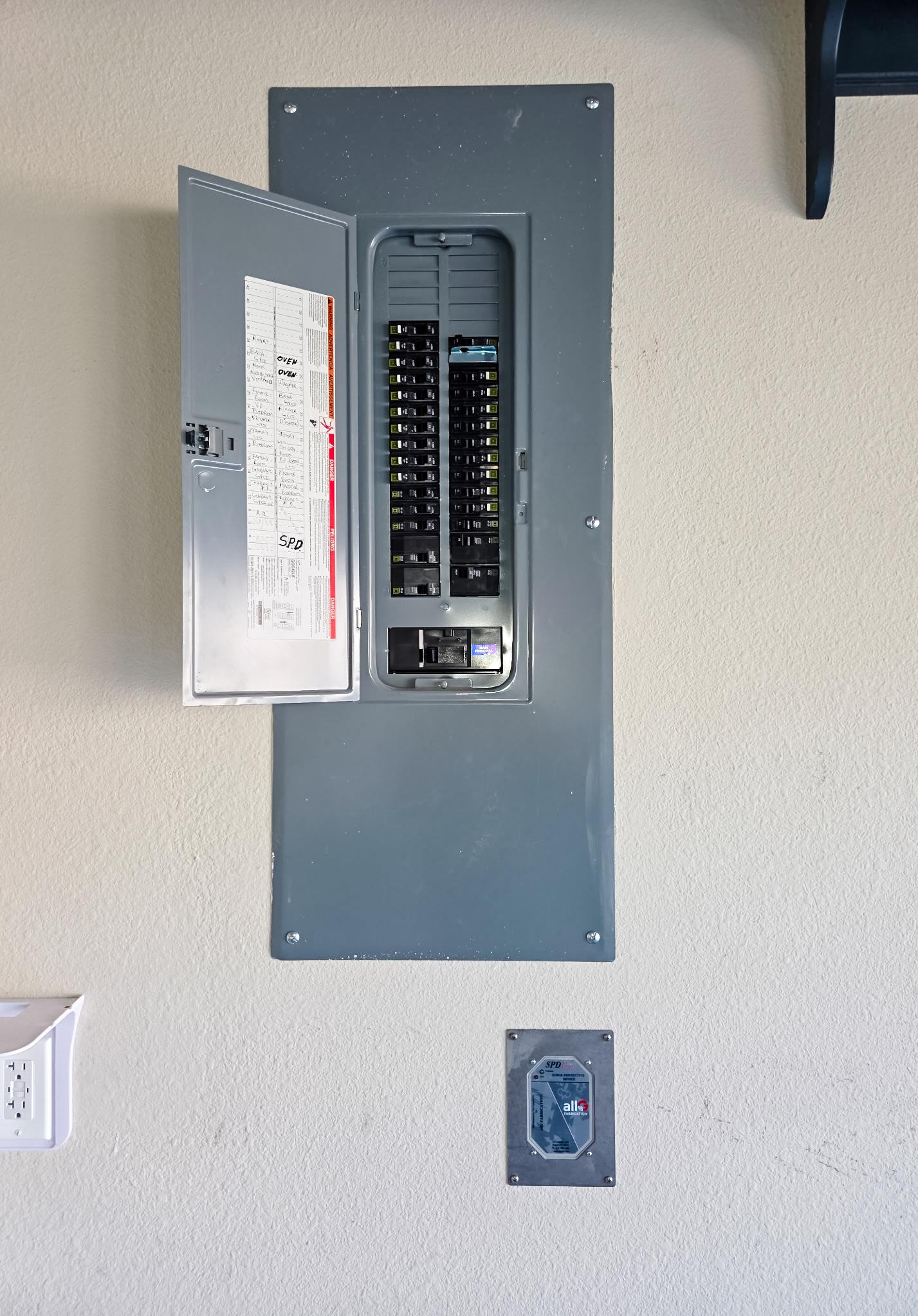 Main electrical panel with whole home surge protection installed by Lightning Safety Solutions.