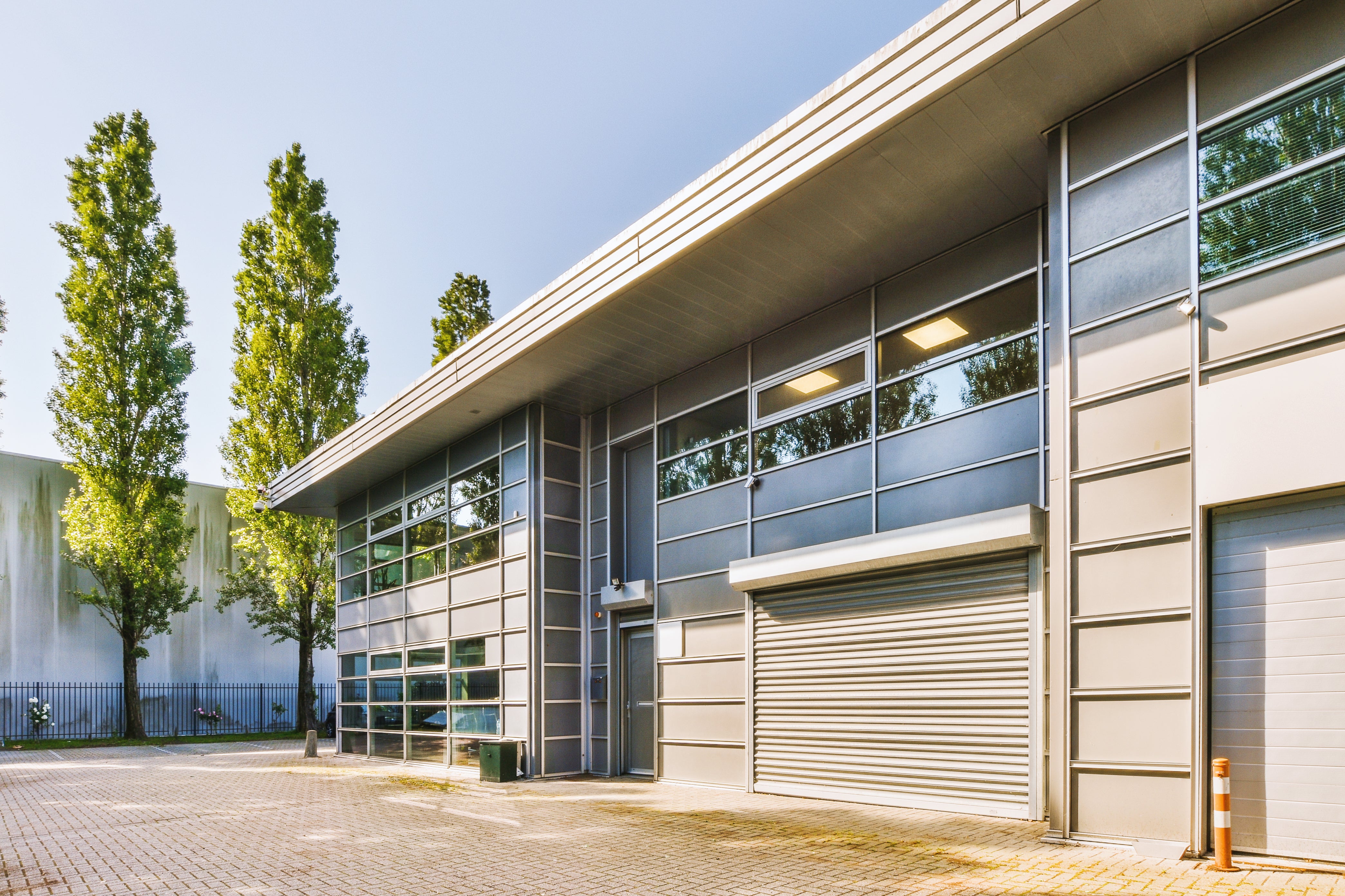Modern industrial commercial building representing facilities that benefit from professional lightning protection and grounding by Lightning Safety Solutions.